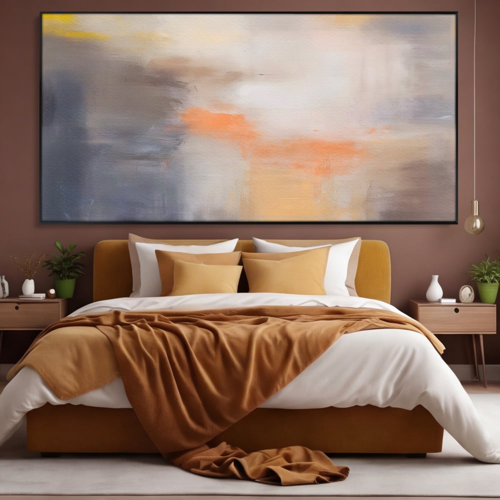 Tablou canvas cu pictura abstracta cu pete portocalii, in rama de aluminiu negru, pe perete intr-un dormitor